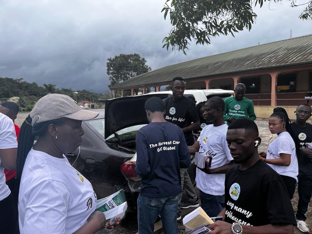 The crew gathered with outreach materials before a programme