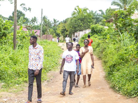 Walking the village path to the next home