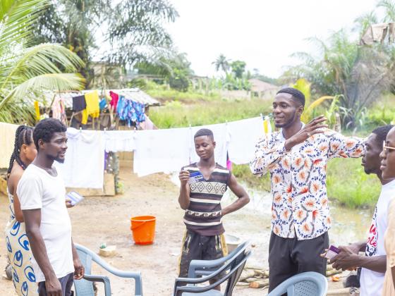 Gathered in a family compound to hear the Gospel